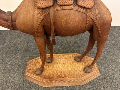 Lot 96 - A pair of teak camel occasional tables