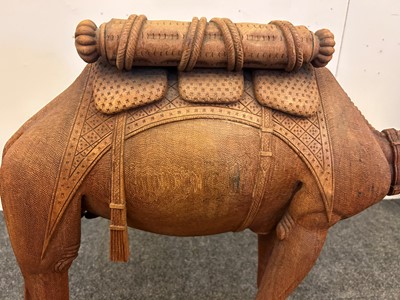Lot 96 - A pair of teak camel occasional tables