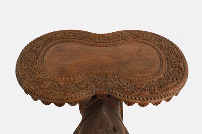 Lot 96 - A pair of teak camel occasional tables