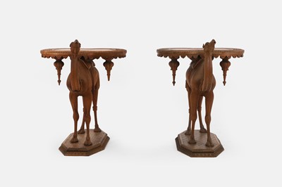 Lot 96 - A pair of teak camel occasional tables