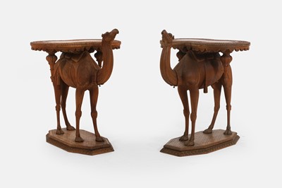 Lot 96 - A pair of teak camel occasional tables