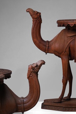 Lot 96 - A pair of teak camel occasional tables