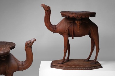 Lot 96 - A pair of teak camel occasional tables