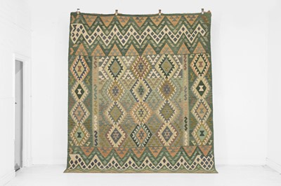Lot 311 - A kilim flat-weave wool carpet
