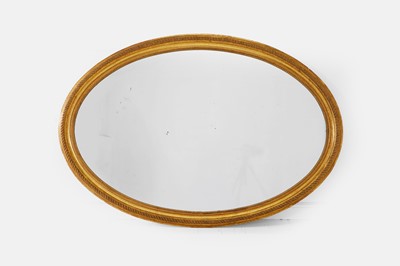 Lot 463 - A large carved giltwood and gesso oval mirror