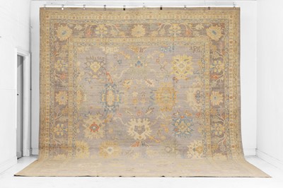 Lot 99 - An Oushak wool carpet