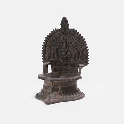 Lot 235 - An Indian Gaja lakshmi ceremonial bronze 'deepak' candleholder