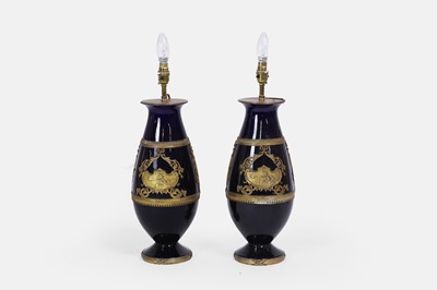 Lot 455 - A pair of cobalt-blue porcelain and gilt-brass table lamps