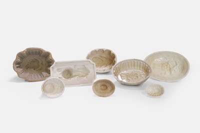 Lot 202 - A large collection of pottery jelly moulds