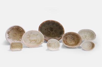 Lot 204 - A large collection of pottery jelly moulds