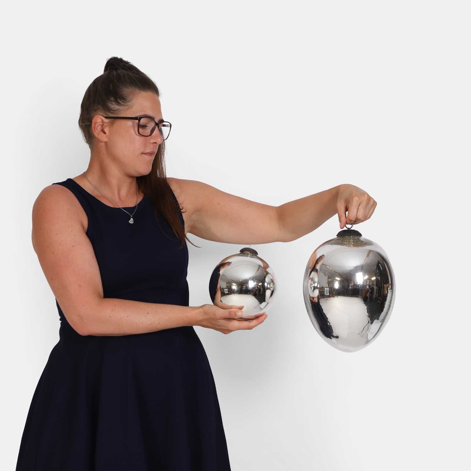 Lot 69 - Two silvered witches' balls