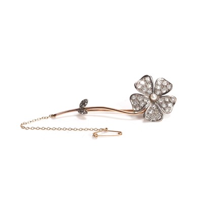 Lot 39 - An antique diamond and seed pearl floral brooch