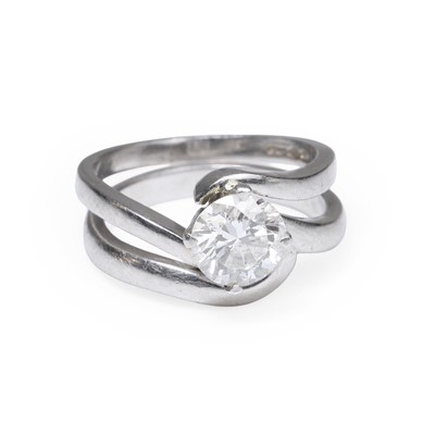 Lot 170 - A platinum diamond single stone ring and a fitted band ring
