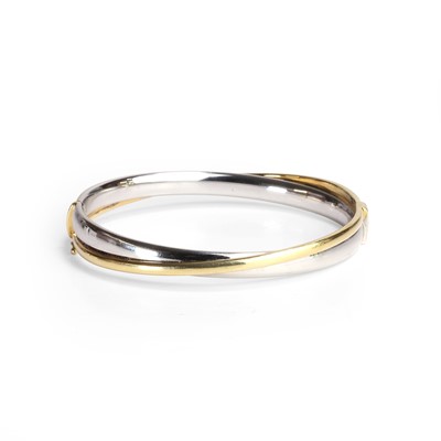 Lot 96 - A bi-coloured 18ct gold bangle