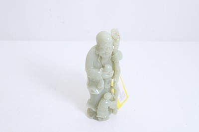 Lot 60 - A Chinese carved jade figure of Shoulao
