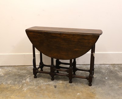 Lot 519 - A George I walnut gateleg table