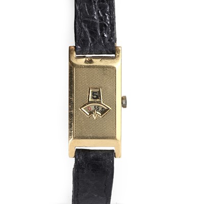 Lot 247 - A Swiss 18ct gold jump hour mechanical strap watch