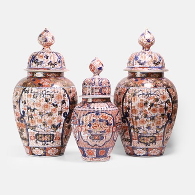 Lot 320 - A pair of Japanese Imari porcelain baluster jars and covers