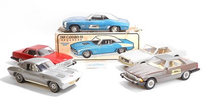 Lot 19 - A collection of model car whiskey decanters