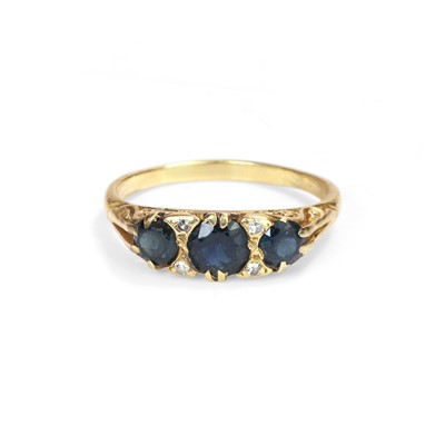 Lot 165 - A sapphire and diamond three stone ring