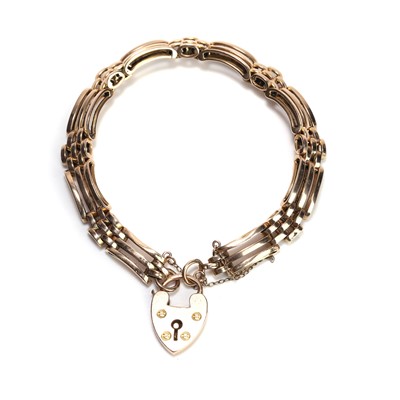 Lot 24 - An Edwardian 15ct gold three bar gate bracelet