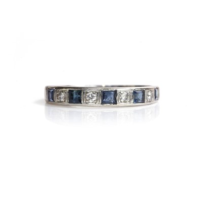 Lot 153 - An 18ct white gold sapphire and diamond half eternity ring