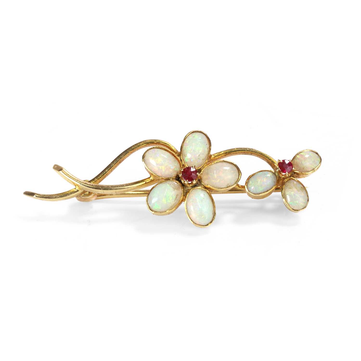 Lot 32 - An Art Nouveau opal and ruby brooch