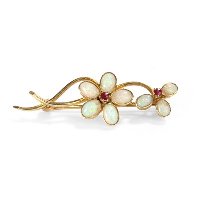Lot 32 - An Art Nouveau opal and ruby brooch