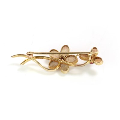Lot 32 - An Art Nouveau opal and ruby brooch