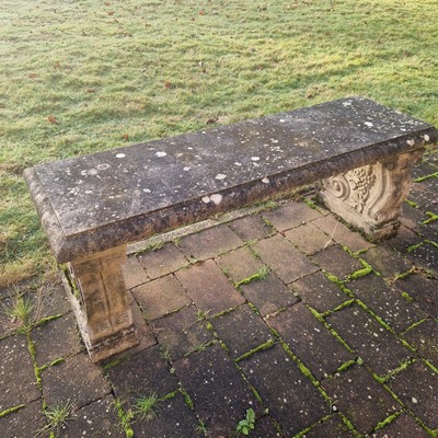 Lot 551 - Two composite stone garden benches