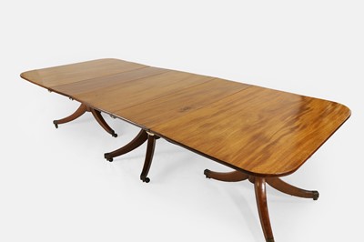Lot 205 - A George III mahogany three-pillar dining table
