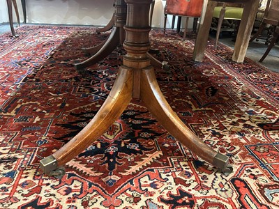 Lot 205 - A George III mahogany three-pillar dining table