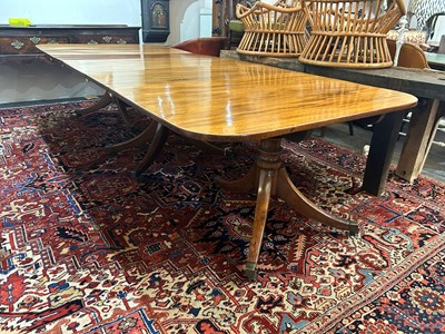 Lot 205 - A George III mahogany three-pillar dining table
