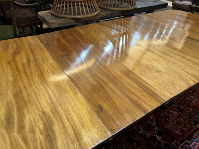 Lot 205 - A George III mahogany three-pillar dining table