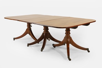 Lot 205 - A George III mahogany three-pillar dining table
