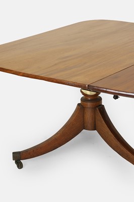 Lot 205 - A George III mahogany three-pillar dining table