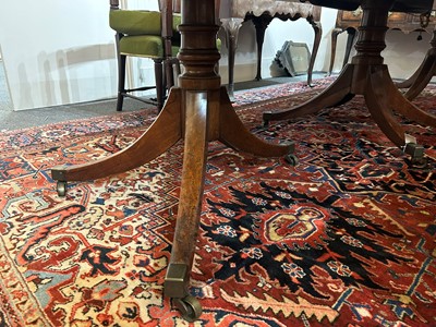 Lot 205 - A George III mahogany three-pillar dining table