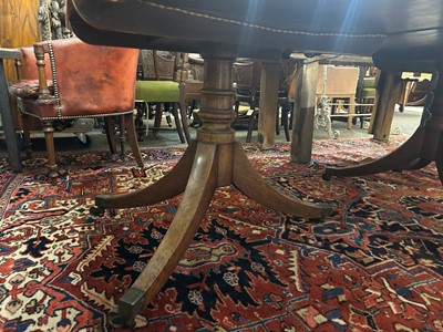 Lot 205 - A George III mahogany three-pillar dining table