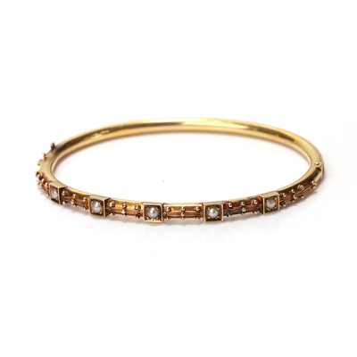 Lot 22 - A late Victorian seed pearl hinged bangle