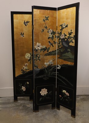Lot 542 - A four-fold carved and lacquered screen