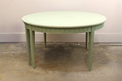 Lot 547 - A painted extending dining table