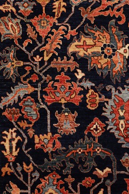 Lot 77 - A wool carpet of antique Heriz design