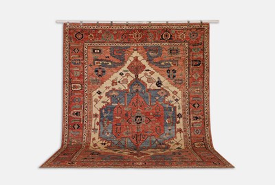 Lot 155 - A wool carpet of antique Persian Heriz design