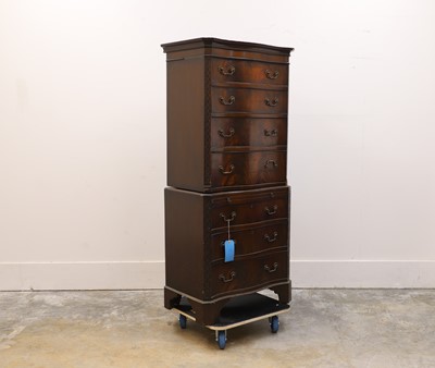 Lot 505 - A flame mahogany serpentine chest on chest