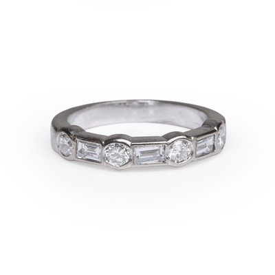 Lot 105 - A diamond seven stone half eternity ring