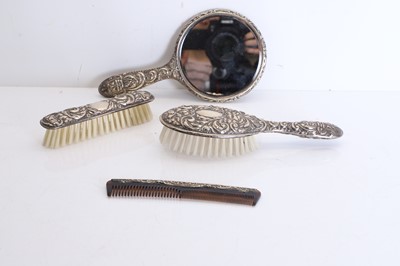 Lot 11 - A collection of silver handled brushes