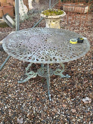 Lot 554 - A painted cast-iron circular table