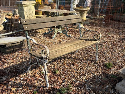 Lot 556 - A painted cast iron and wooden bench