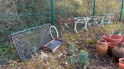 Lot 558 - A collection of garden cast iron items