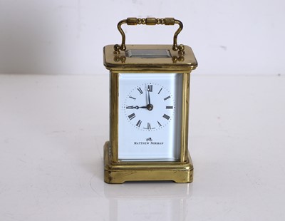 Lot 201 - A modern brass carriage clock